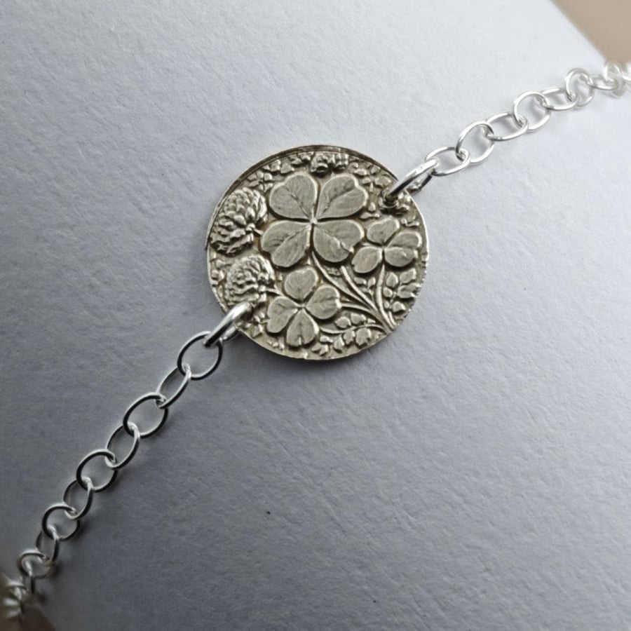 Image of Four Leaf Clover Engraved Sterling Silver Coin Bracelet