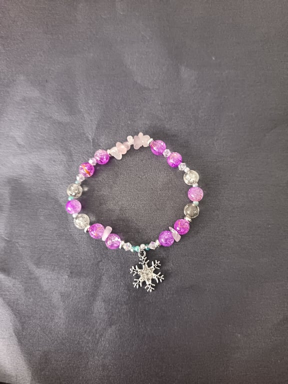 Elasticated beaded winter bracelet with crystal chip and silver snowflake charm 