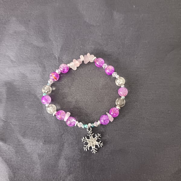 Elasticated beaded winter bracelet with crystal chip and silver snowflake charm 