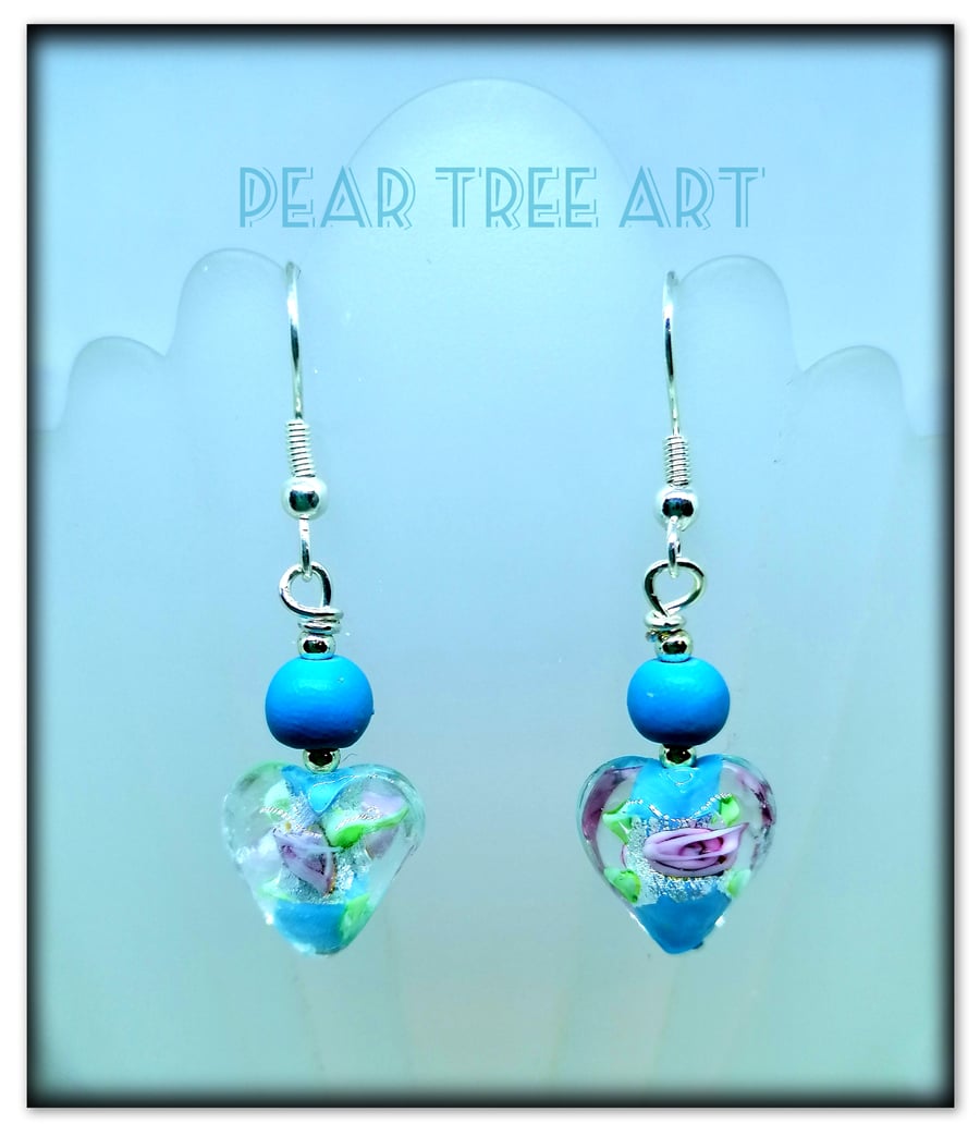 Blue Glass Heart drop earrings on Silver plated hooks.