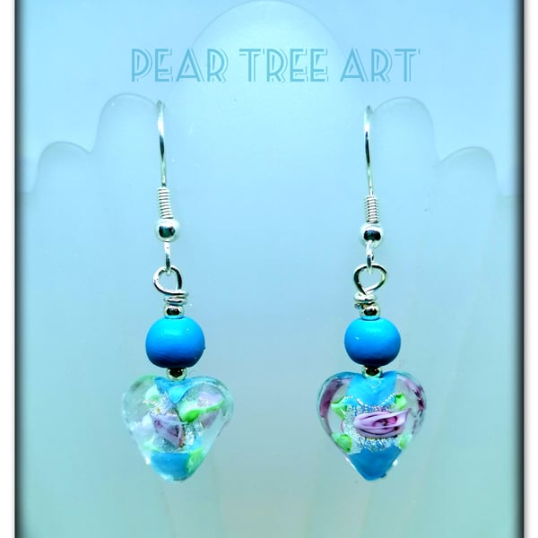 Blue Glass Heart drop earrings on Silver plated hooks.