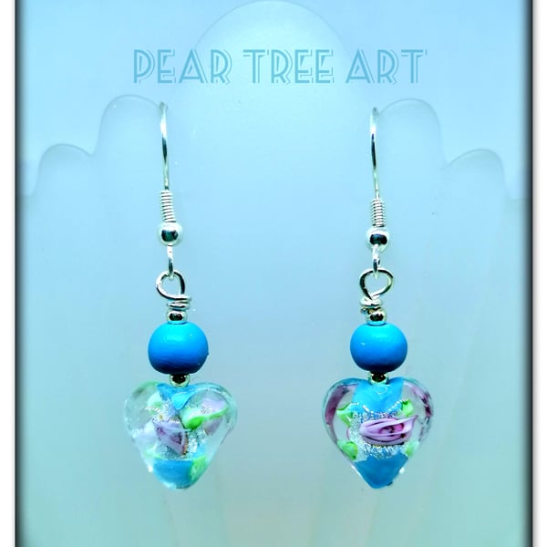 Murano glass blue heart drop bead earrings on Silver plated hooks.