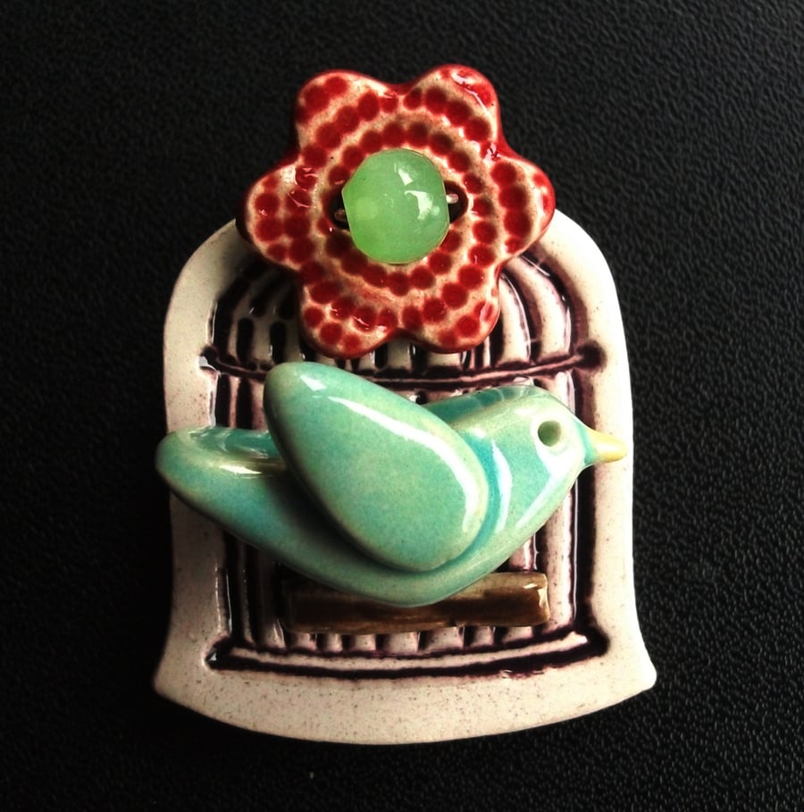 little ceramic bird cage brooch with flower button and bead