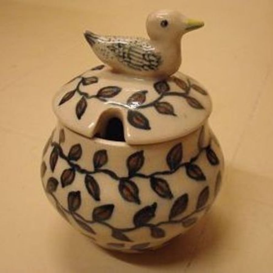 lidded jar with bird