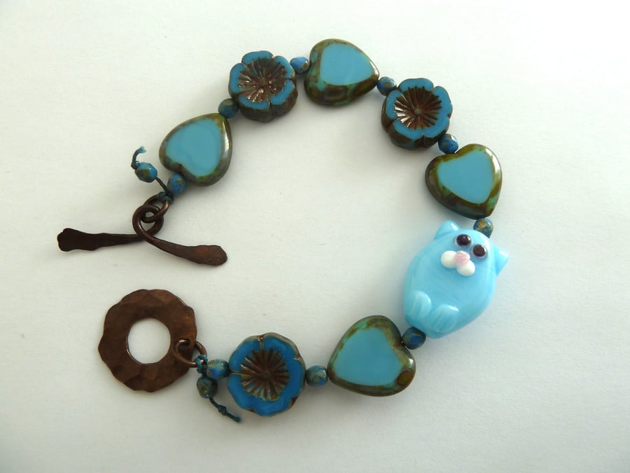 blue cat lampwork glass and copper bracelet