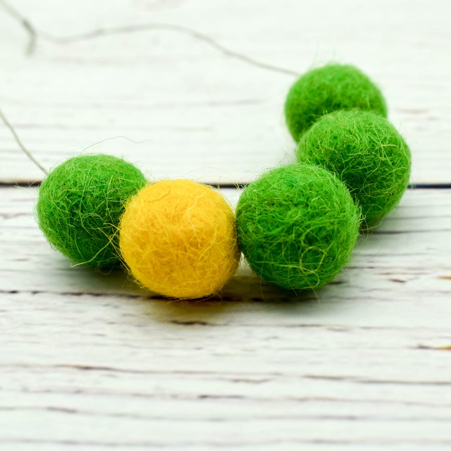 Felted bead necklace in green and yellow wool