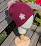 Red Crochet Beanie Hat with decorative flower design  - Image 1