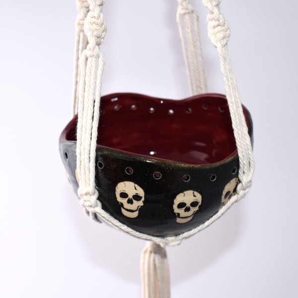 A30 Hand thrown skulls hanging planter