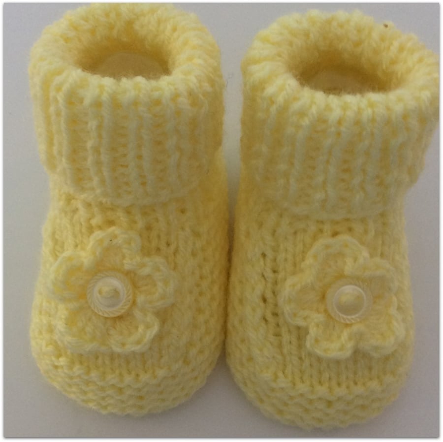  Baby Booties in lemon with flower decoration