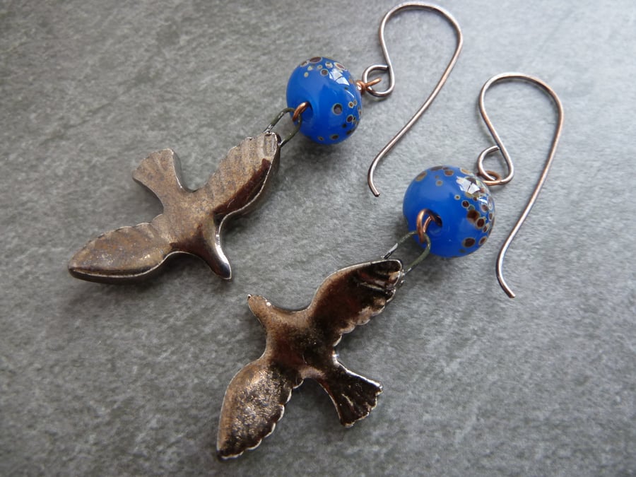 copper, blue lampwork glass, ceramic bird earrings