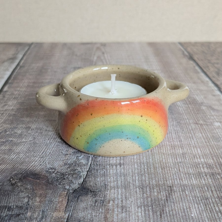 Speckled ceramic tealight holder with rainbow design