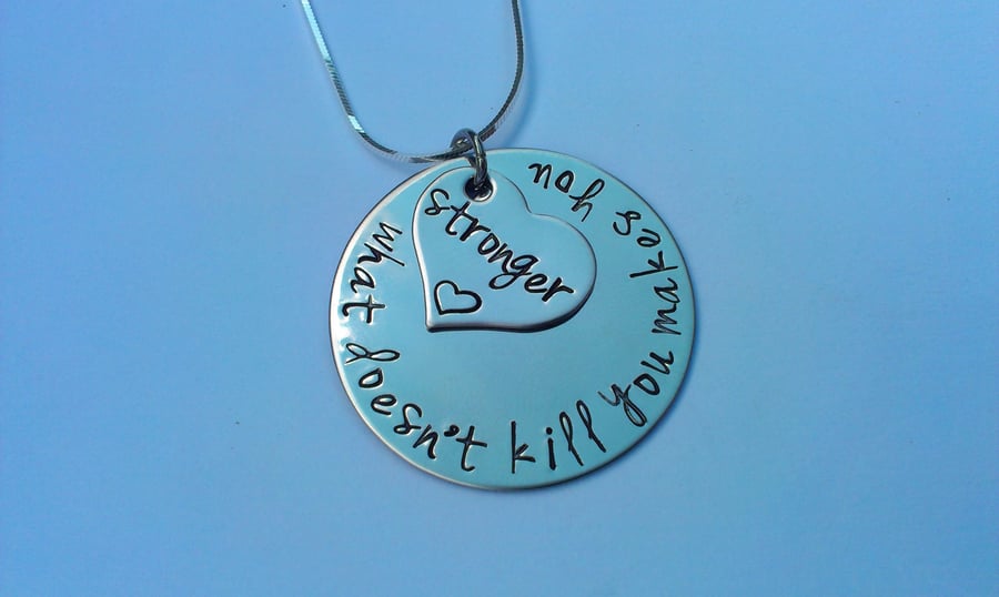 What doesn't kill you makes you stronger Hand Stamped necklace