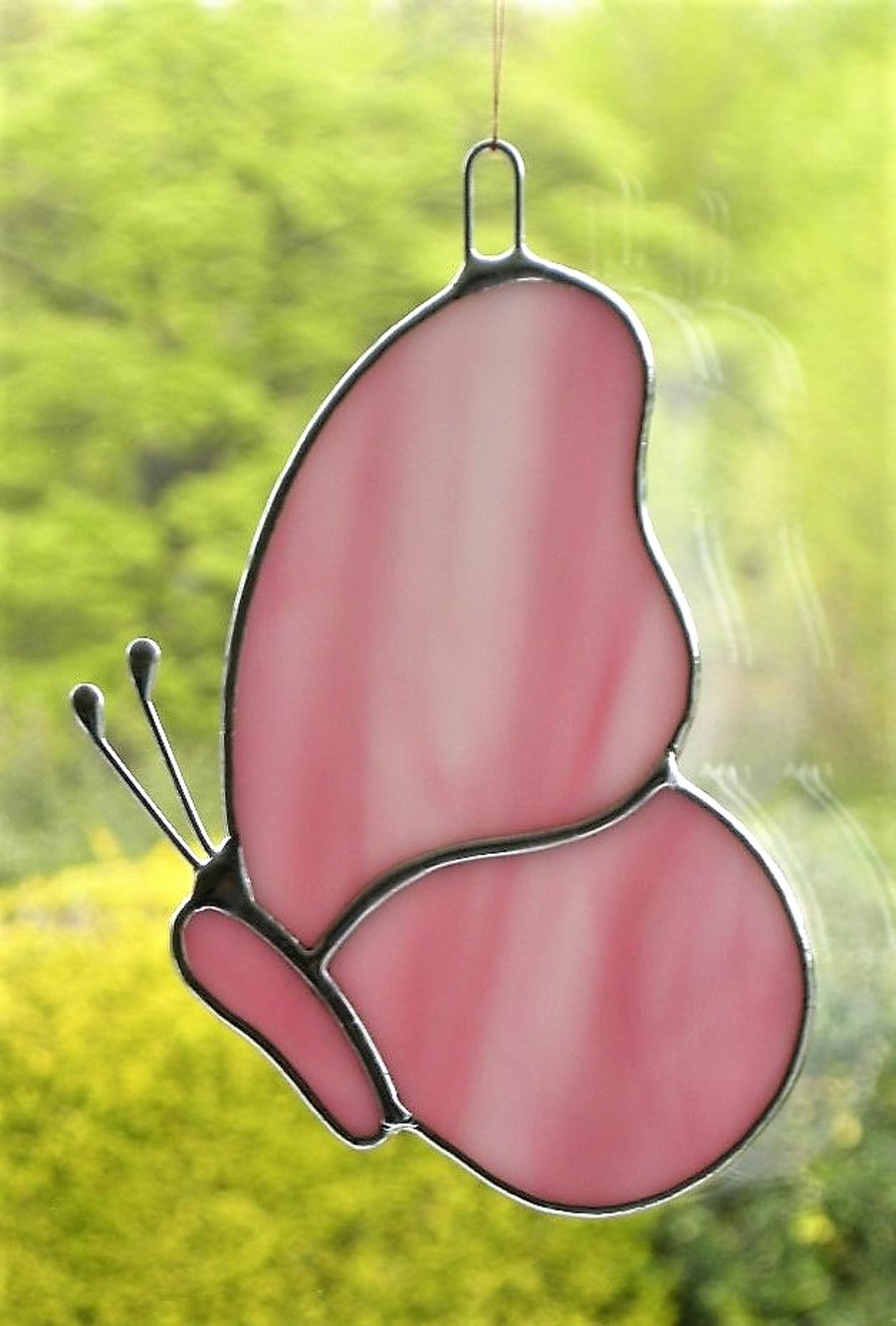 Stained Glass Butterfly in pink and white swirling opalescent glass