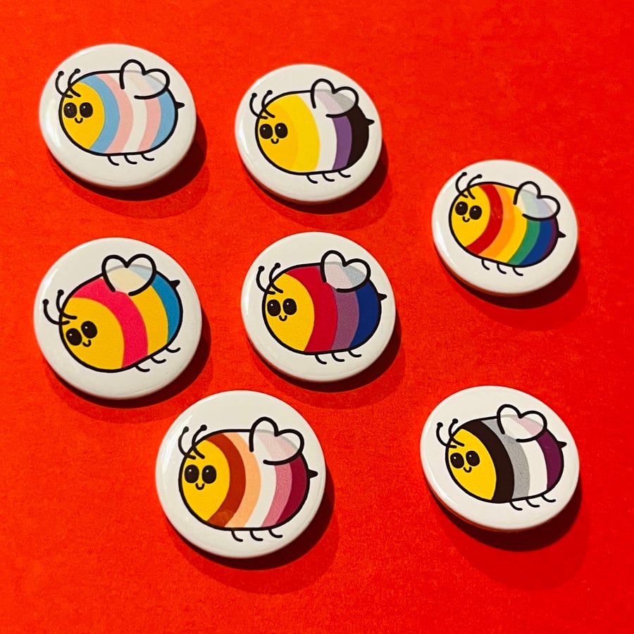 Pride bee badge, magnet, pocket pebble or keyring.  LGBTQIA Flag colours