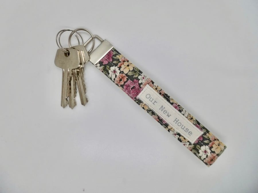 Key ring Our New House wrist strap