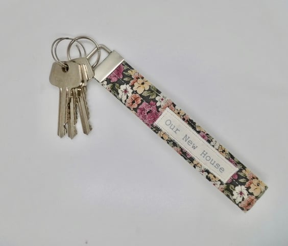 Key ring Our New House wrist strap