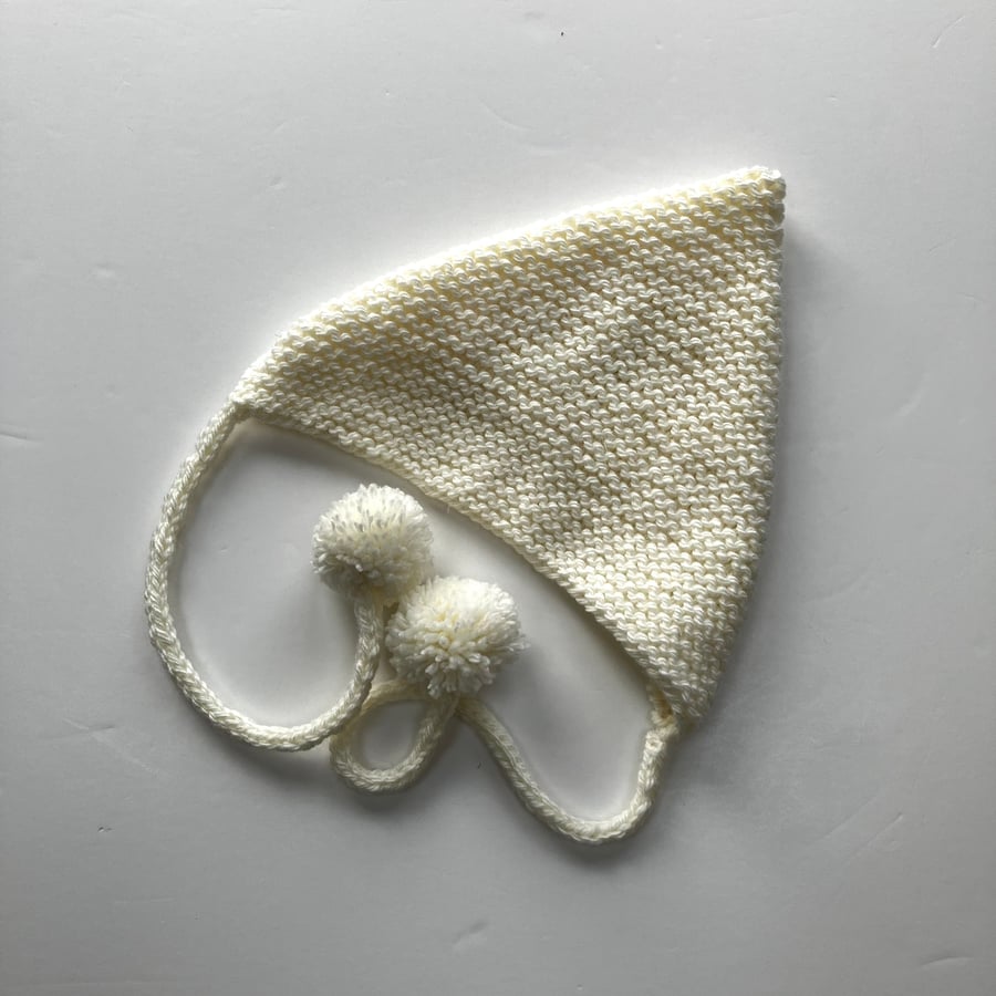 Hand knit baby cream pixie bonnet with pompoms 
