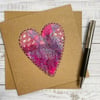 Up-cycled pink embroidered heart card. 