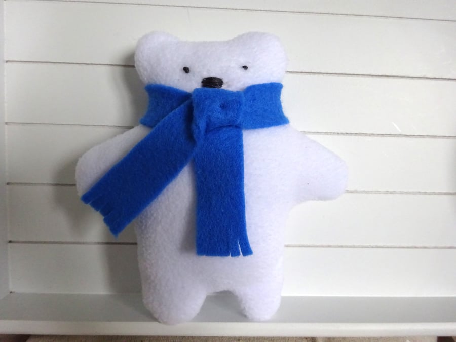 polar bear with blue scarf