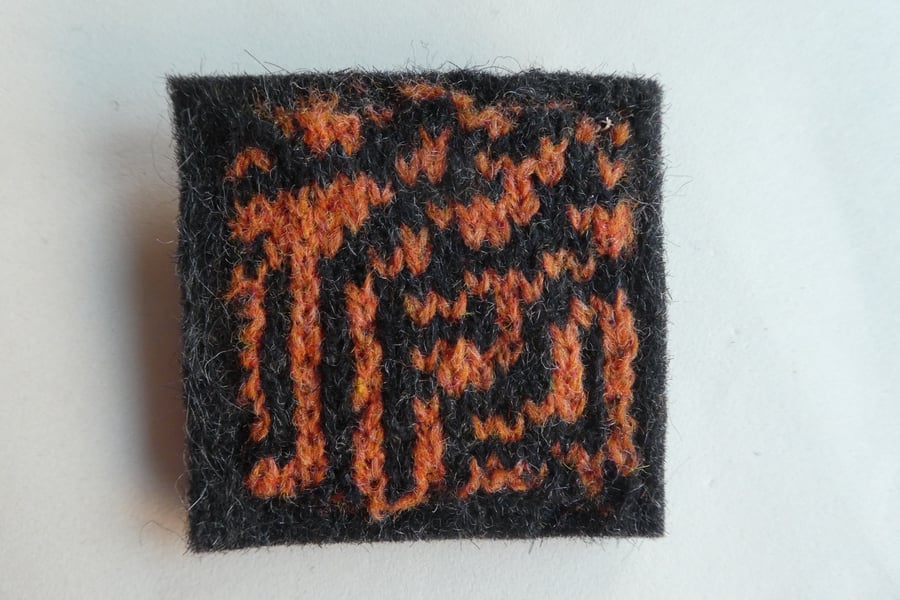 Rule 30 brooch - Charcoal grey with orange and black, square, needle felted.