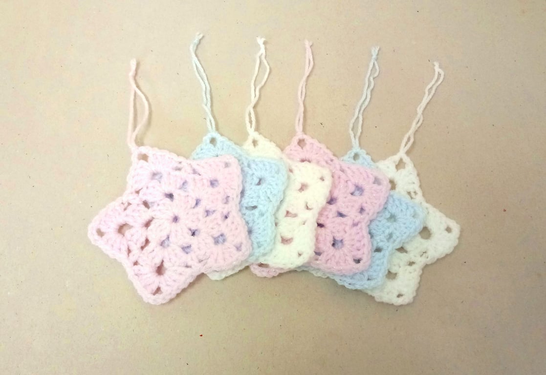 Christmas star decorations, set of six, in pink, white and blue. 