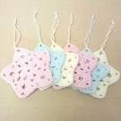 Christmas star decorations, set of six, in pink, white and blue. 