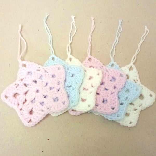 Christmas star decorations, set of six, in pink, white and blue. 