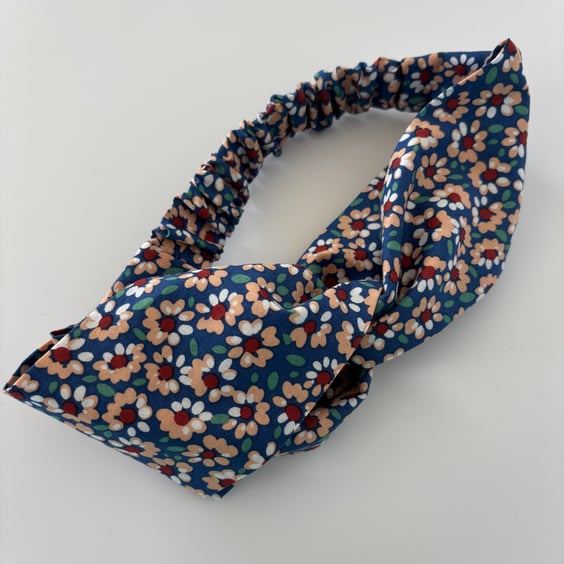 Cotton headband, twist knot style hairband in blue with a daisy floral print.