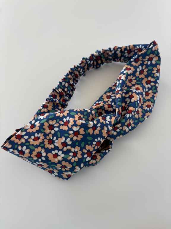 Cotton headband, twist knot style hairband in blue with a daisy floral print.