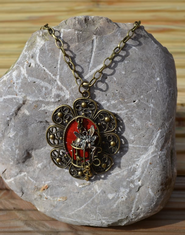 "Fairy lets the bird out of the cage" pendant necklace
