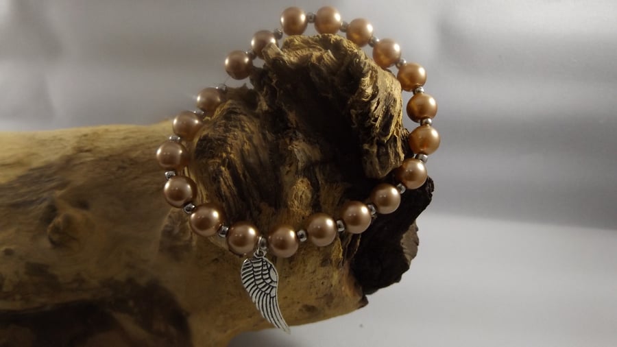 pearl bracelet with angel wing charm