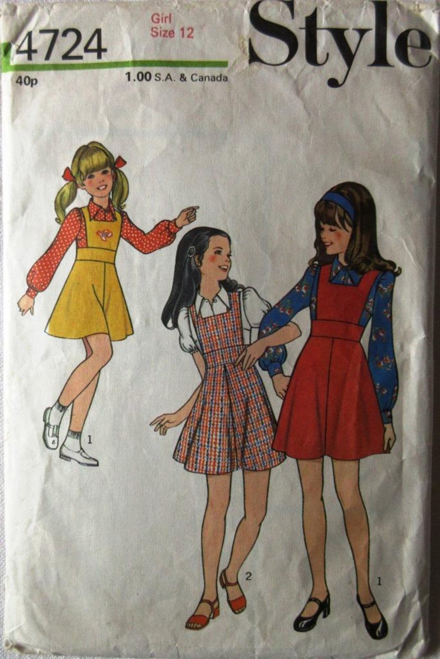 A sewing pattern for a girl's pinafore dress and blouse in size 12 (chest 30")