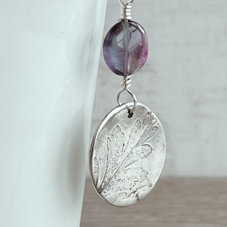 Botanical silver pendant with leaf design and fluorite bead.