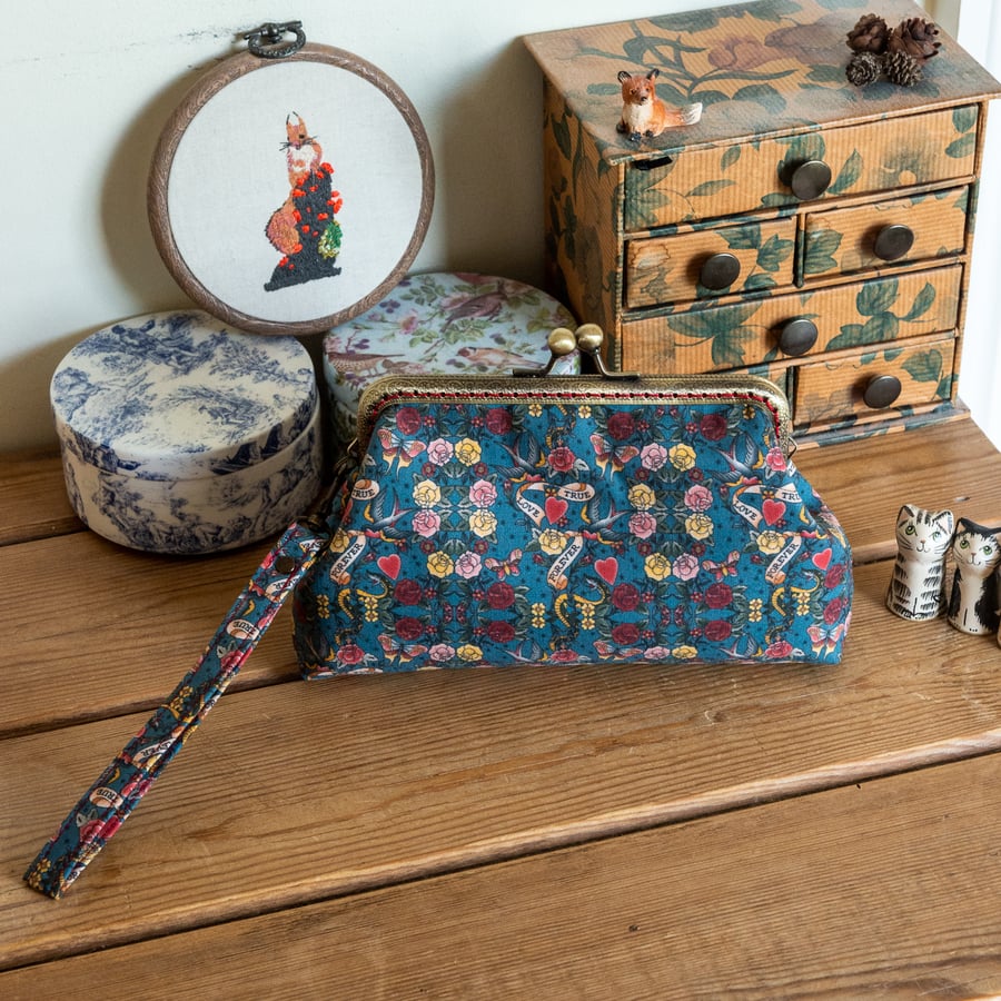 Wristlet purse or small clutch made with beautiful vintage classic tattoo cotton