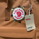 Fjallraven backpack in rust with hand embroidered mushrooms and roses 