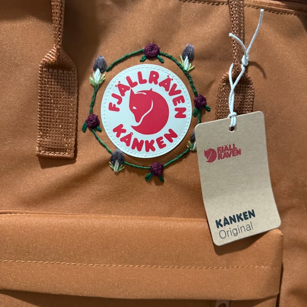 Fjallraven backpack in rust with hand embroidered mushrooms and roses 