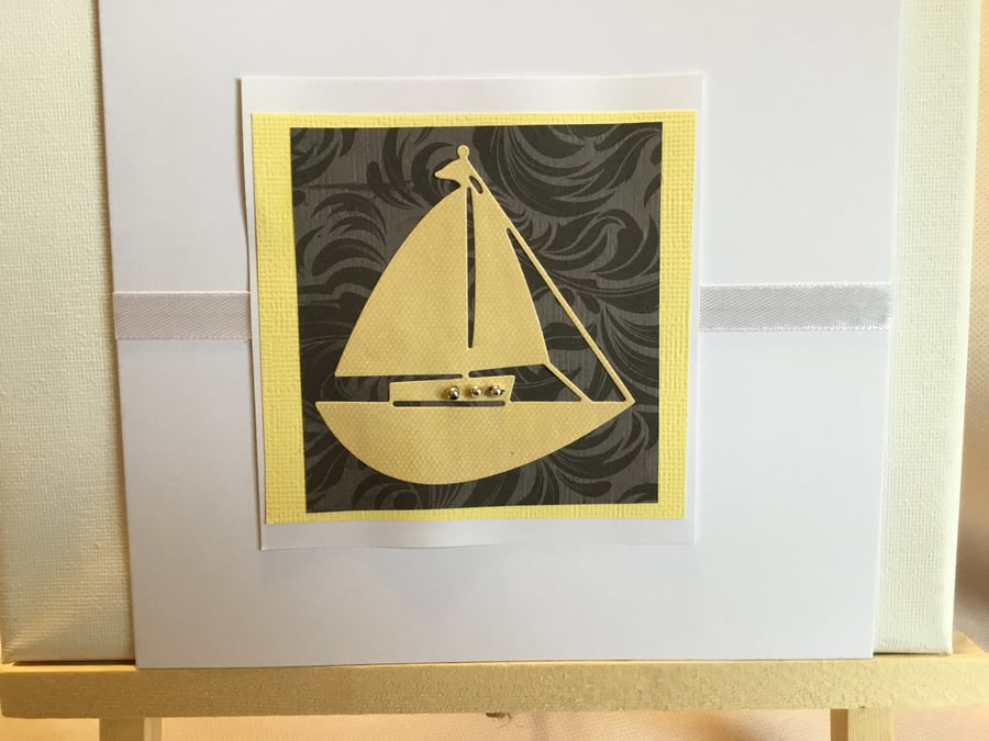 A vibrant yellow boat card