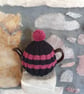 Small Tea Cosy for 2 Cup Tea Pot, Black & Pink, Hand Knitted, Wool Mix Yarn - Image 1