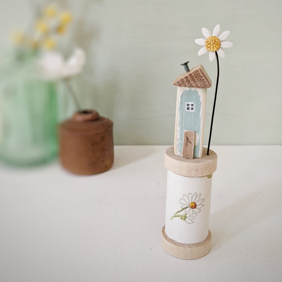 Wooden House on a Floral Bobbin with Clay Daisy