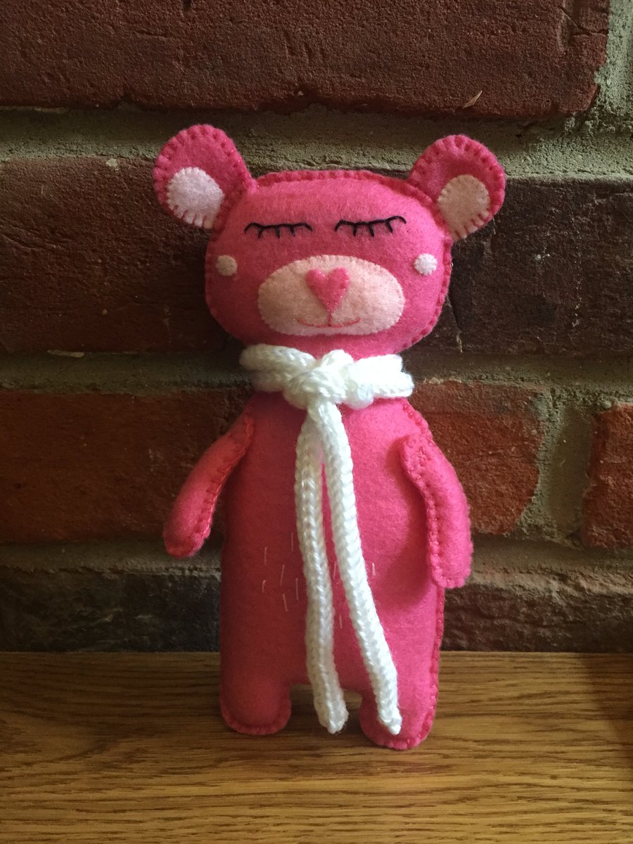 Pink felt teddy bear with knitted scarf