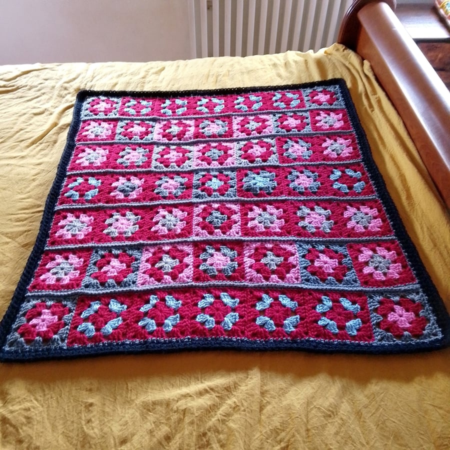 baby or toddler blanket in a red and grey theme.