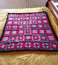 baby or toddler blanket in a red and grey theme.