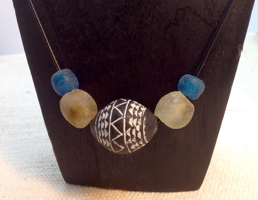 Cord necklace for men or women with African beads and a spinning whorl 