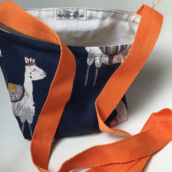 Peg bag, cross-body style. Blue alpaca fabric with orange strap.