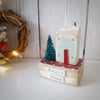 Wooden cottage with Christmas fir tree 'Happy Home'