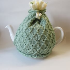 Tea cosy tea cosie - knitted pastel green with crocus flowers