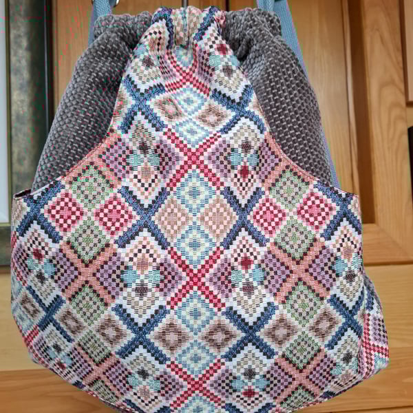 Velvet and tapestry drawstring backpack