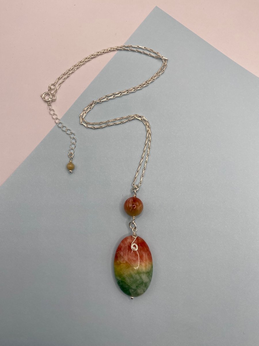 Watermelon solar quartz oval pendant with silver plated spiral