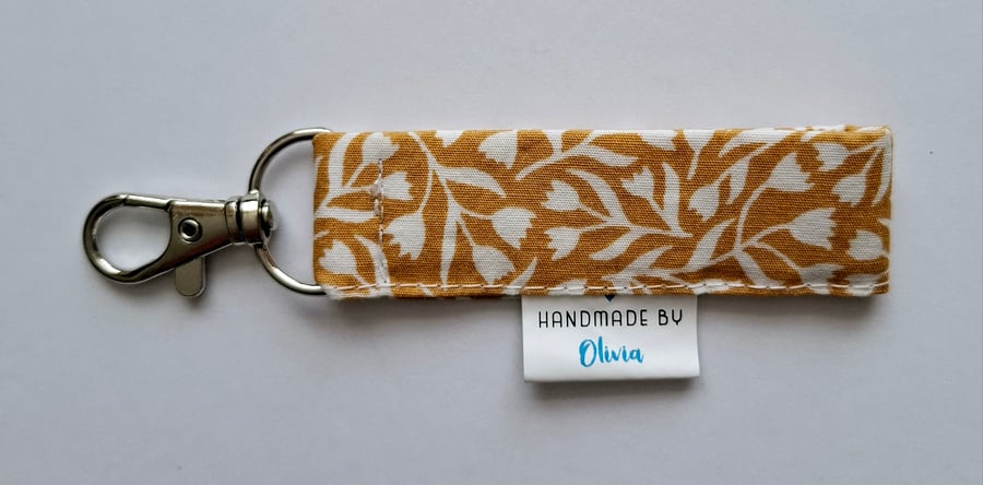 Mustard coloured fabric keyring