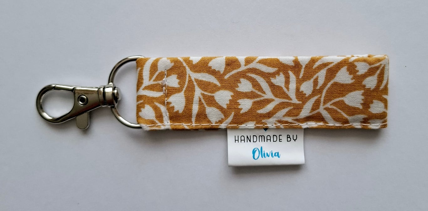 Mustard coloured fabric keyring